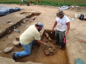 Johnie Sanders (left) and Kevin McClosky (right) begin to investigate the root cellar.